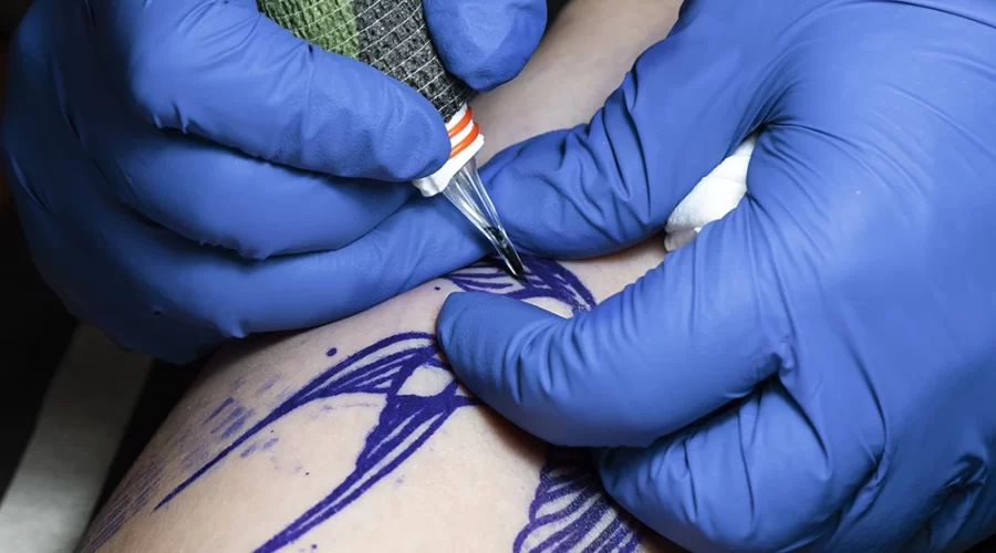 experienced-tattoo-artist-working-client-tattoo copy